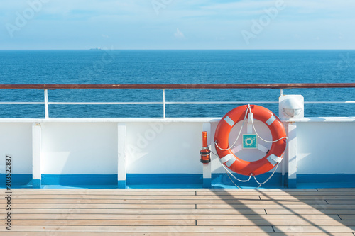 Ship deck, buoy and blue ocean. Travel background