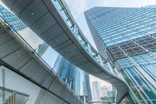 Modern office building and pedestrian walkway in Hong Kong city