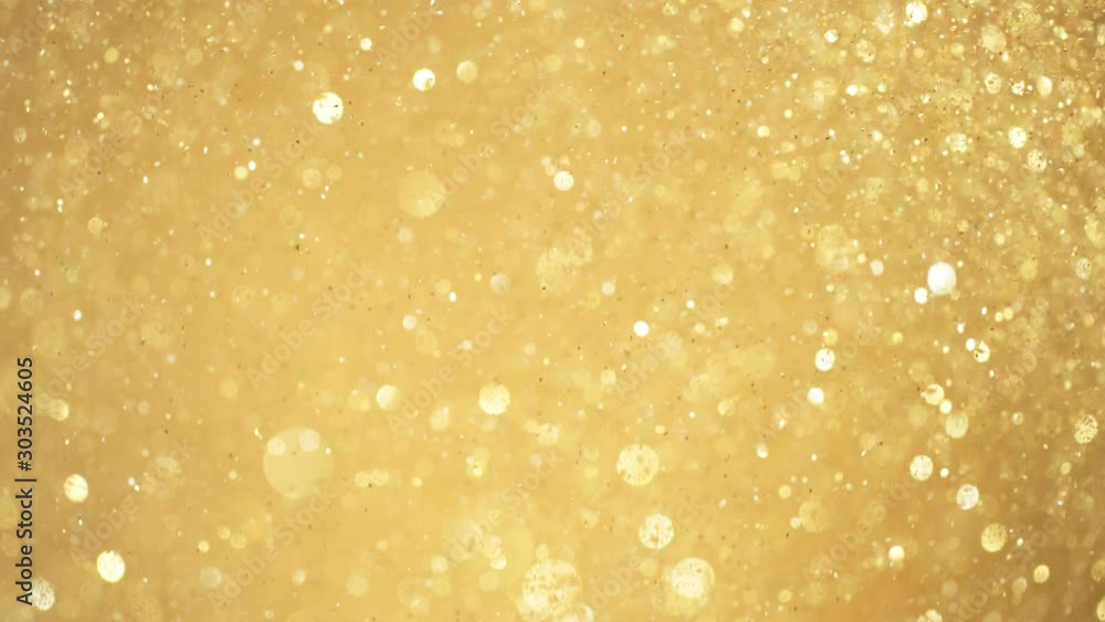 Golden Glitter Background in Super Slow Motion at 1000fps. Golden Glitter Background in Super Slow Motion at 1000fps.