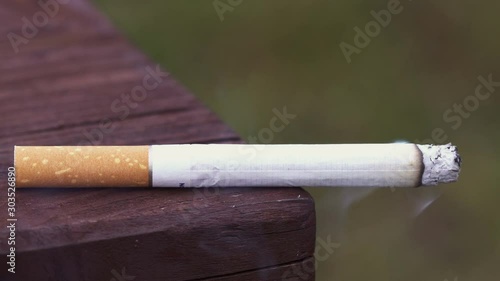 Cigarette on the bench in public place 4K