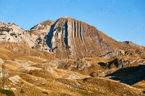 Sunset view on Montenegro Prutash mountain. Durmitor mountains, National Park, Mediterranean, Montenegro, Balkans, Europe. Bright summer view from Sedlo pass. photo