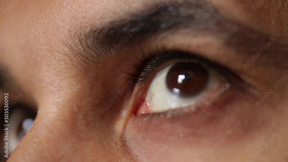 Eyes close up. of a man looking to a window Eyes close up. of a man looking to a window