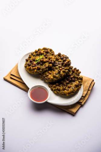 Chana Dal Bhabra / Babra served with tomato ketchup, popular food from Bihar / Bhojpur of India photo