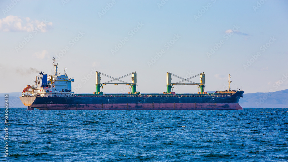 bulk cargo ship to harbor quayside Vladivostok