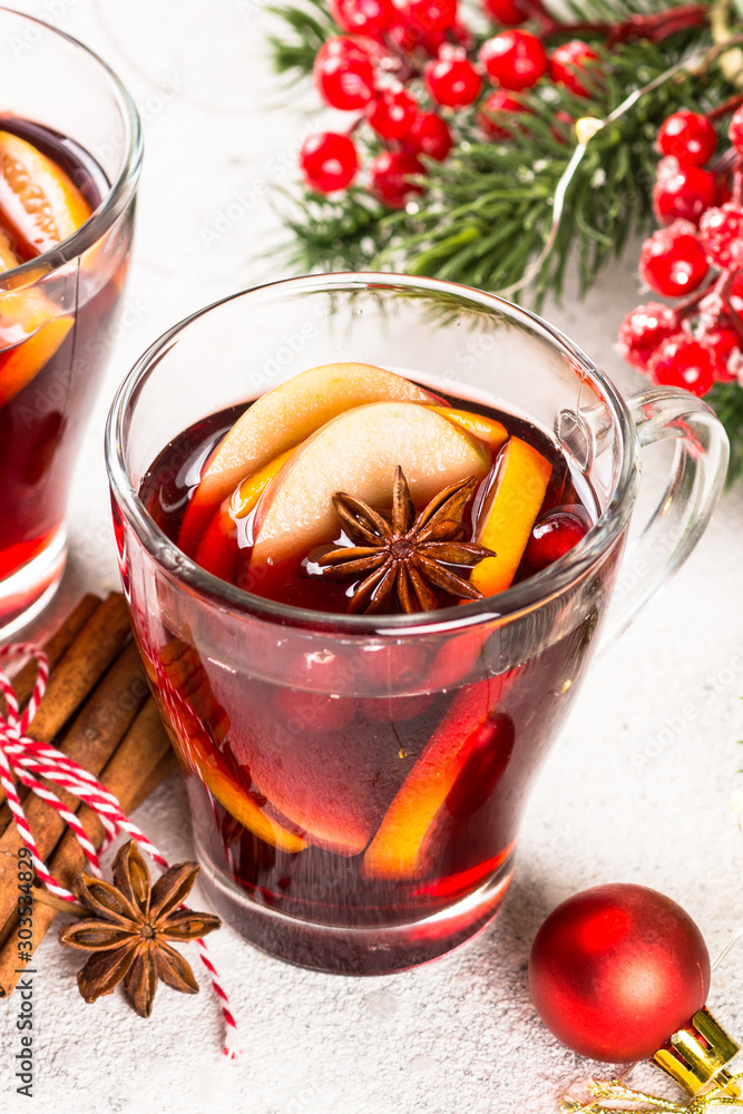 Mulled wine with christmas decorations on white. Mulled wine with christmas decorations on white.