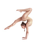 Flexible girl gymnast in beige leotard is performing complex elements of gymnastics while posing isolated on white background. Close-up.