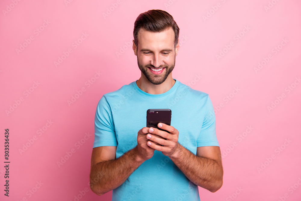 Photo of trendy cheerful positive smm manager browsing through telephone in search of ways to update operating system isolated pastel color background Photo of trendy cheerful positive smm manager browsing through telephone in search of ways to update operating system isolated pastel color background
