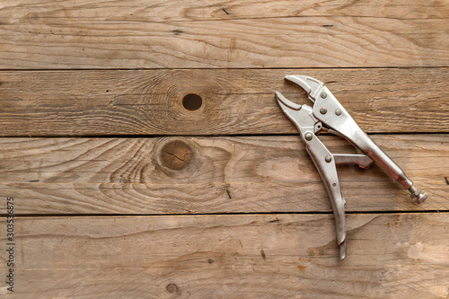 Top view of wrench on wood background and copy space