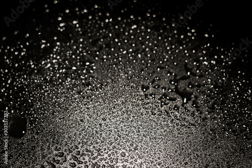  water drop on black background, abstract background and texture.