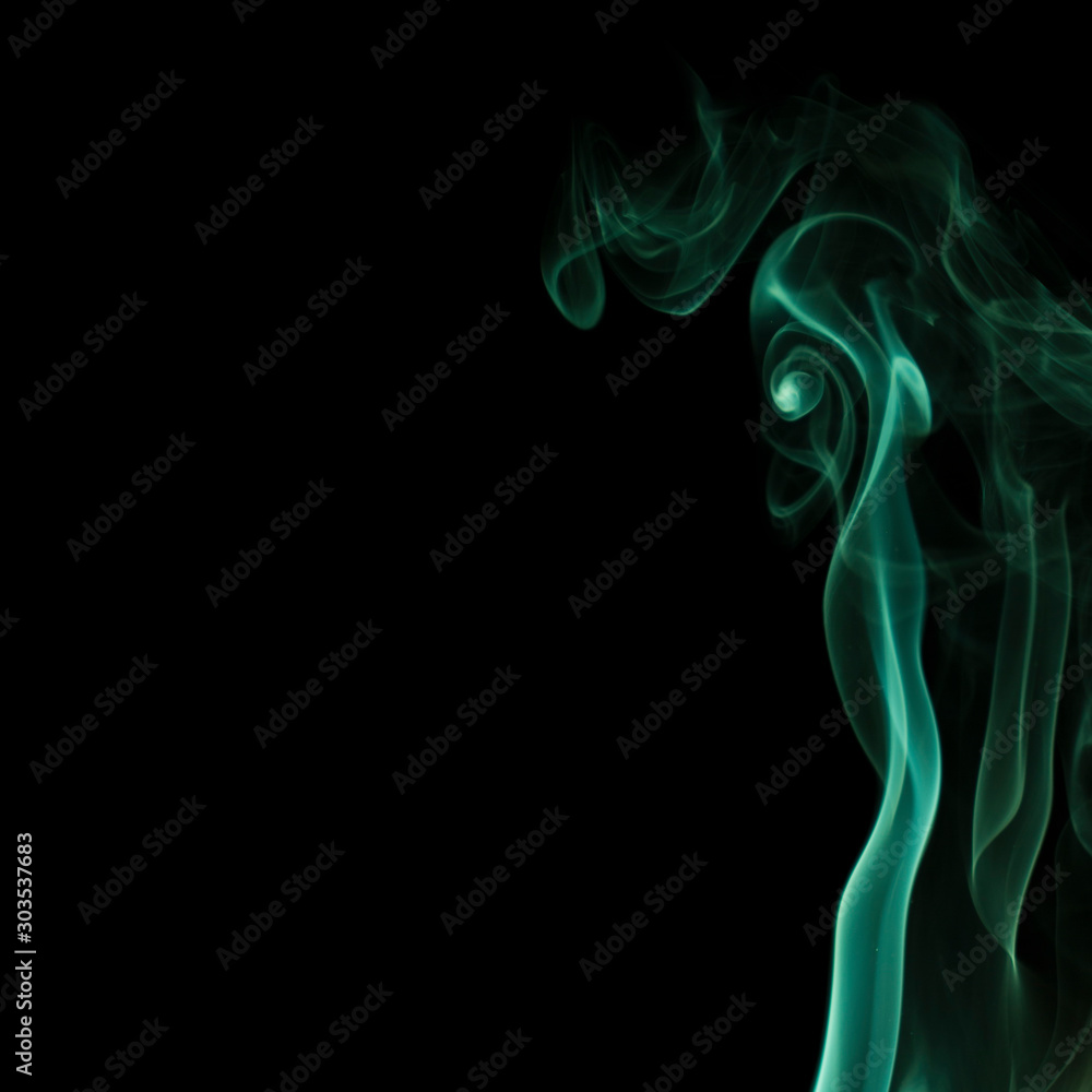 Beautiful swirls of green smoke on a black background Beautiful swirls of green smoke on a black background