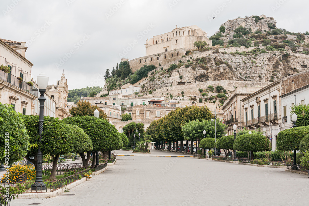 Φωτογραφία SCICLI, ITALY - OCTOBER 3, 2019: street with paving stones on road near old chur