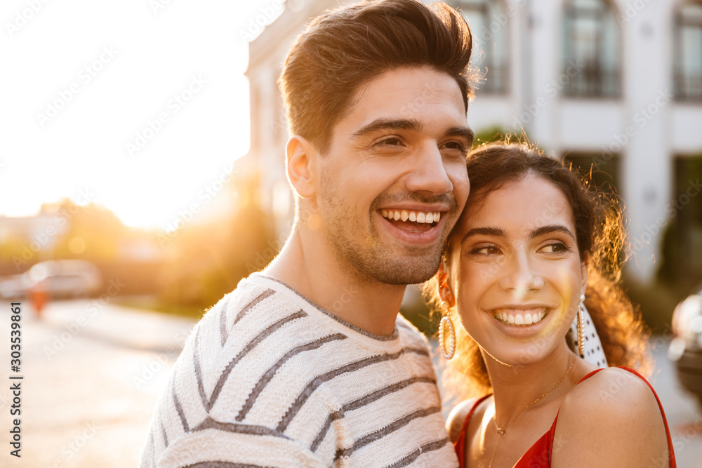 Fototapeta premium Image closeup of happy romantic couple laughing and hugging