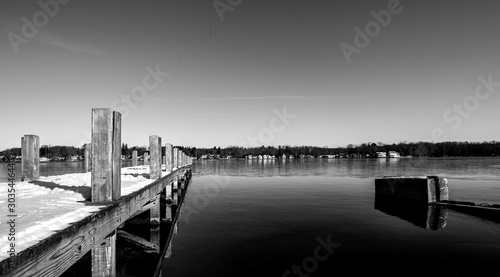 black and white of pier at Chautauqua lake in celeron new york  photo