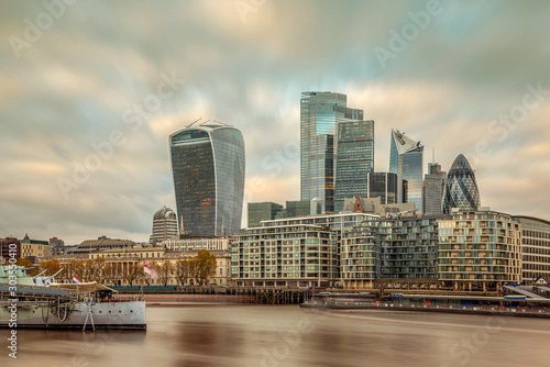London cityscape with Belfast. London military museum. cloudly sky. Business district in the background © GezaKurkaPhotos