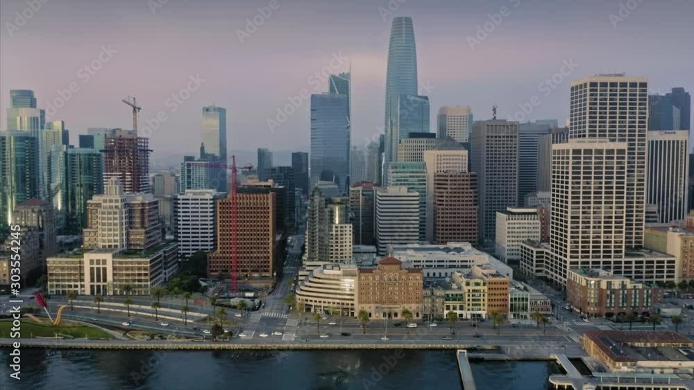 Aerial: San Francisco embarcadero waterfront and the city skyline at sunrise. California, USA. 29 April 2019 Aerial: San Francisco embarcadero waterfront and the city skyline at sunrise. California, USA. 29 April 2019
