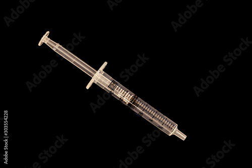 5ml syringe on black background photo