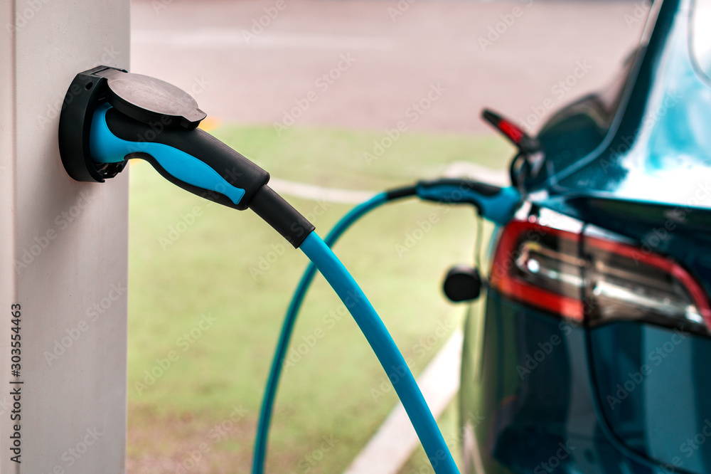Fotografie Electric vehicle charging station point