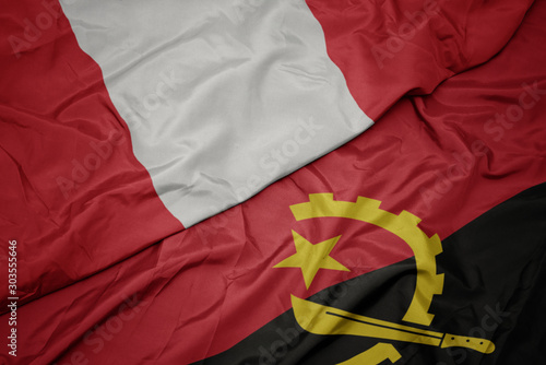 waving colorful flag of angola and national flag of peru.