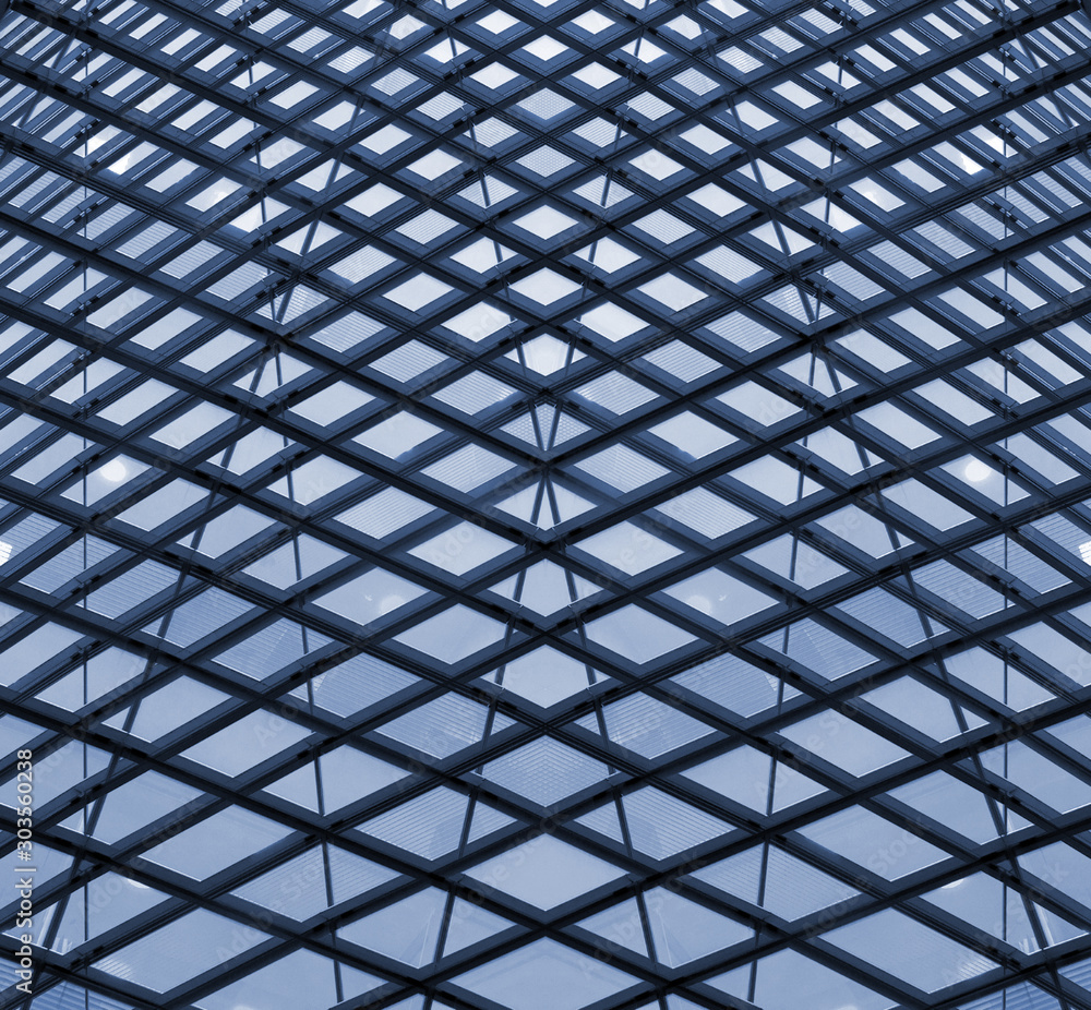 futuristic architectural urban abstract with mirrored repeating geometric windows in shades of blue, property and investment concept futuristic architectural urban abstract with mirrored repeating geometric windows in shades of blue, property and investment concept