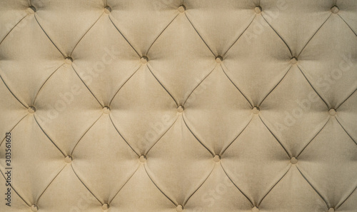 Chesterfield style quilted upholstery backdrop close up. Capitone pattern texture background