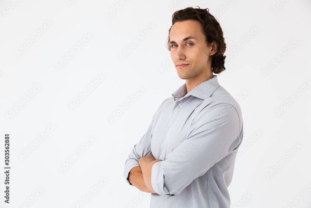 Image of attractive businessman in office shirt looking at camera Image of attractive businessman in office shirt looking at camera