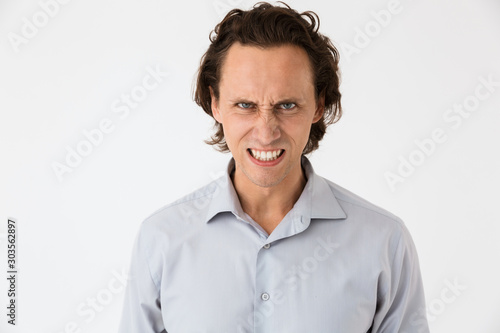 Image of confused businessman in office shirt screaming in anger © Drobot Dean