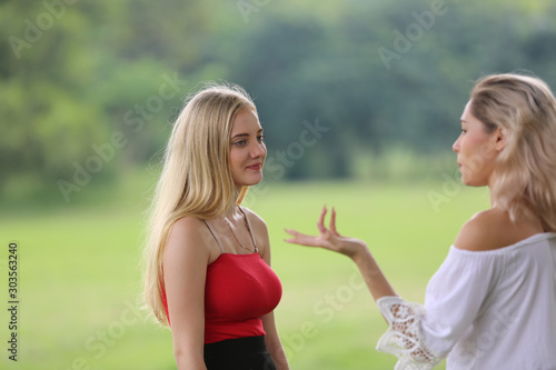 Candid shot of Young women talking outdoor 