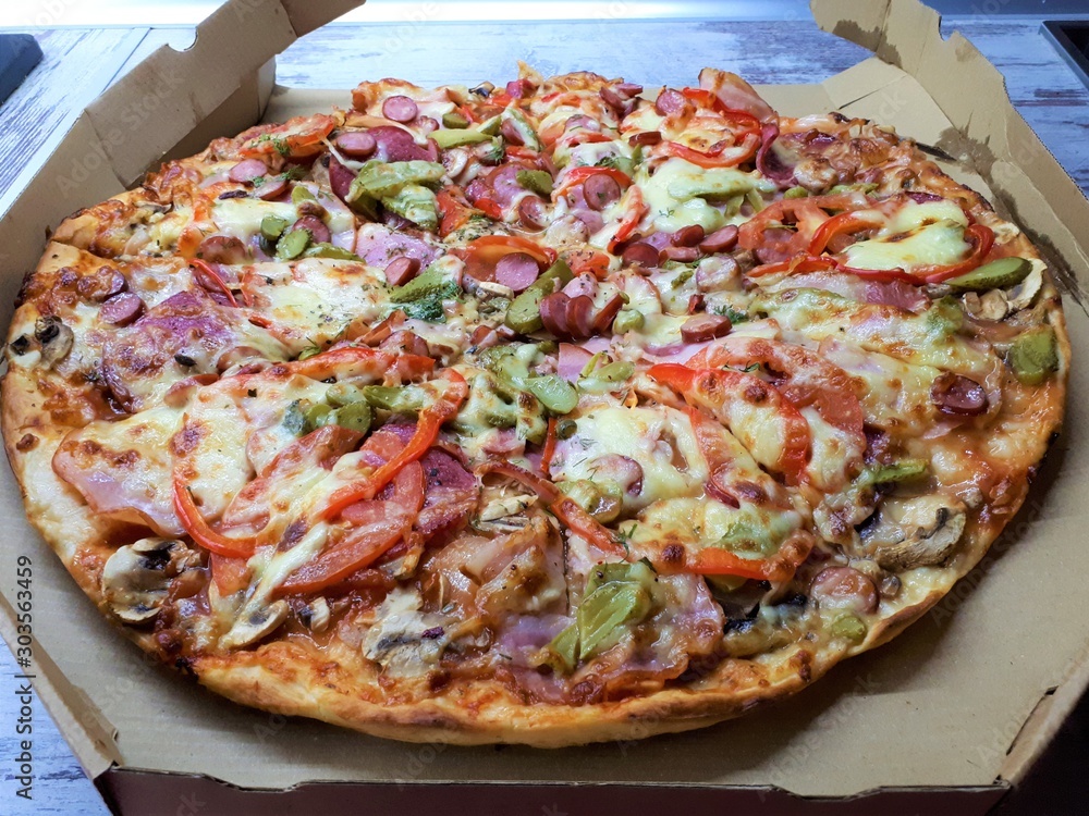 close-up of a big fresh tasty flavorful pizza