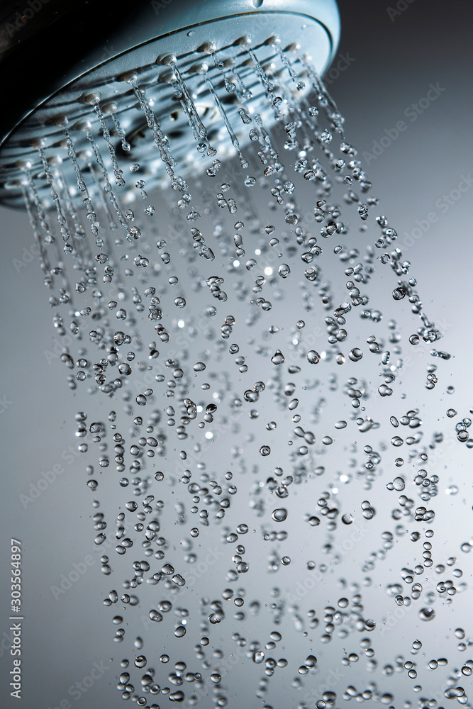 Shower head and water drops in frozen motion. Shower head and water drops in frozen motion.