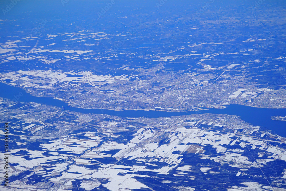 Aerial view of Quebec City, Canada, and the Saint Lawrence River under snow in winter
