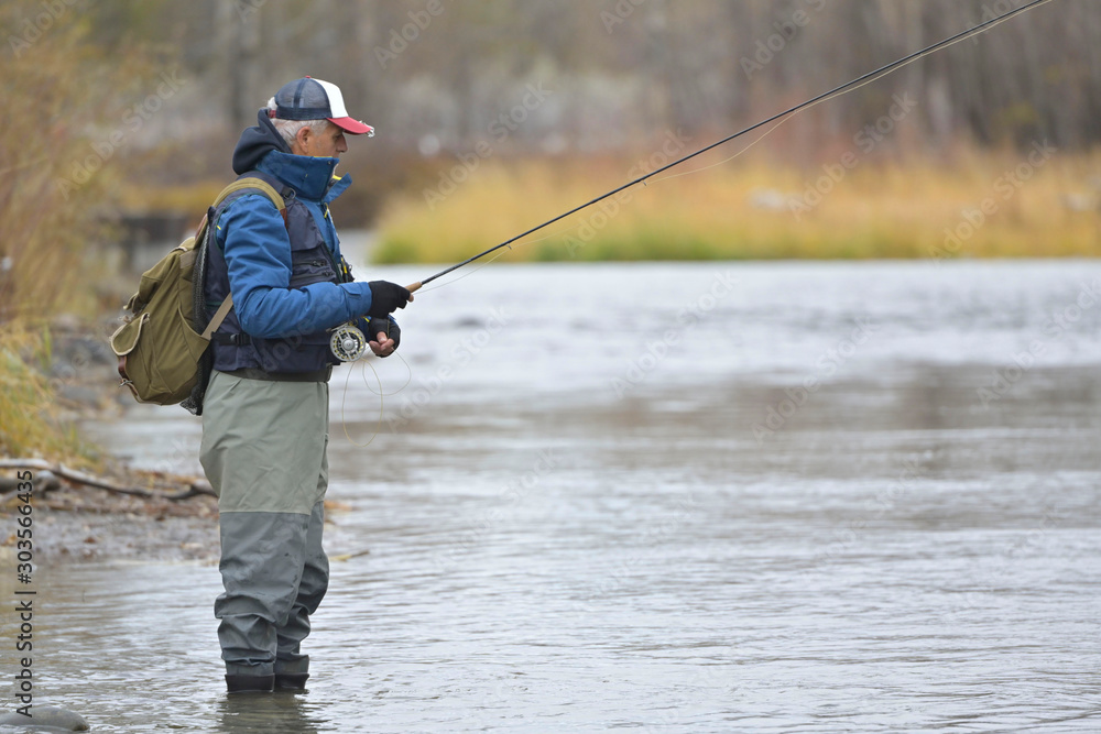 River fly fisherman in Montana River fly fisherman in Montana