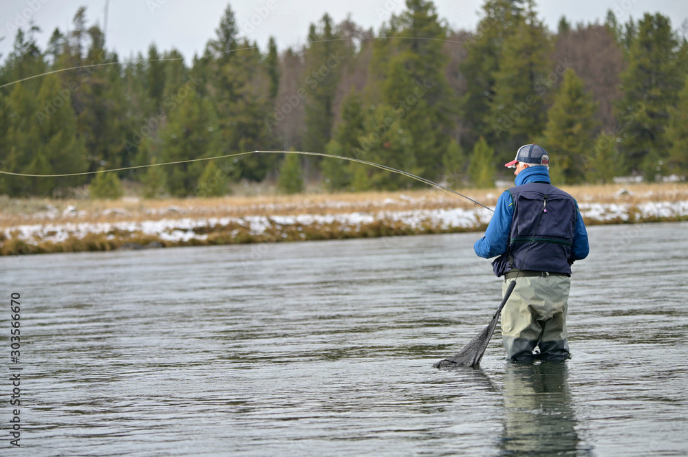River fly fisherman in Montana River fly fisherman in Montana
