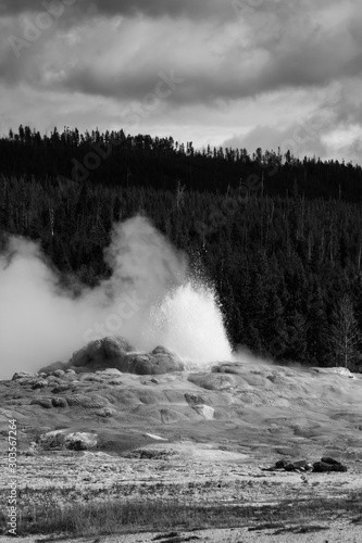 Geyser erupting in black and white