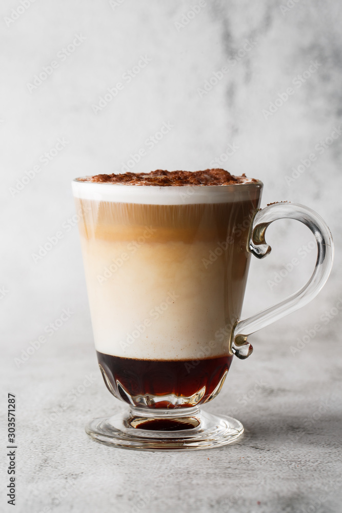 Εκτύπωση καμβά Coffee with Irish whiskey and whipped cream in glass isolated on bright marble background
