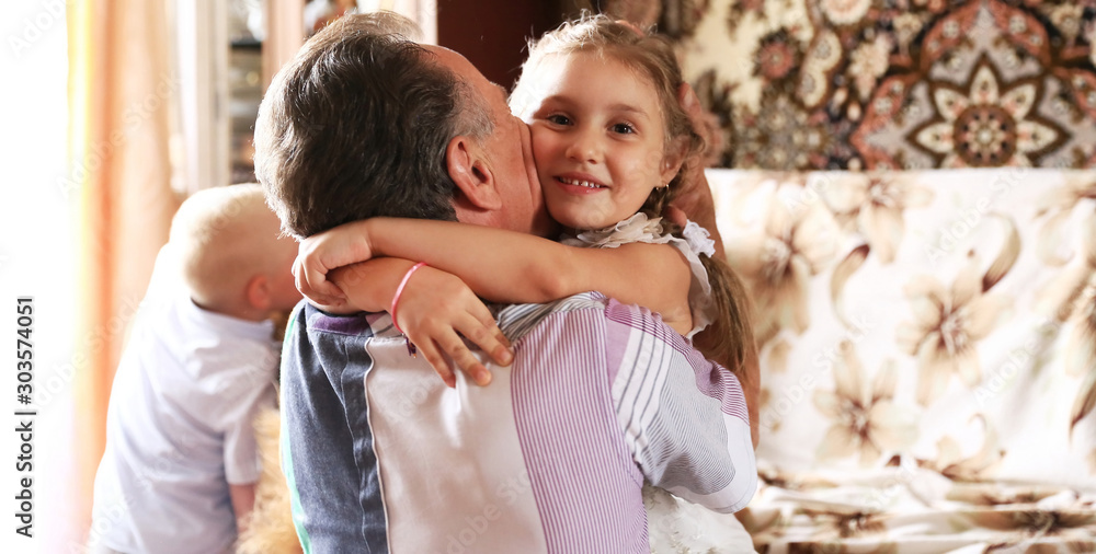 closeup.happy little girl hugging her father. concept of fatherhood closeup.happy little girl hugging her father. concept of fatherhood