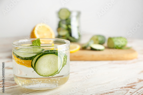 Glass of healthy infused water on table