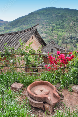 Traditional grain mill in Nuodeng, Yunnan, China photo