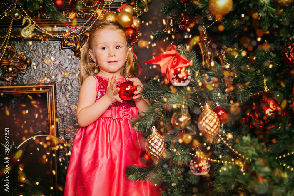 child decorates tree child decorates tree