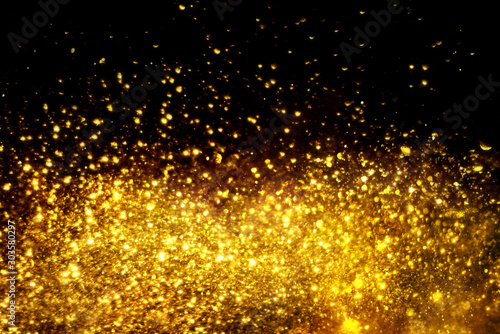 golden glitter bokeh lighting texture Blurred abstract background for birthday, anniversary, wedding, new year eve or Christmas