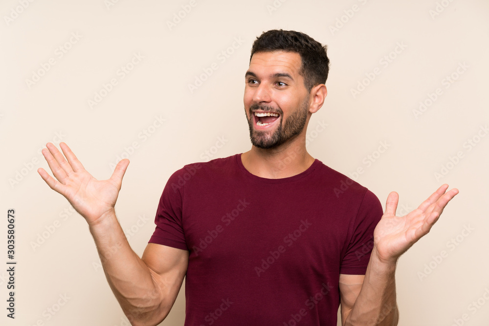 Handsome man over isolated background with surprise facial expression Handsome man over isolated background with surprise facial expression