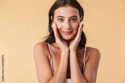 Pretty young woman in swimwear posing isolated