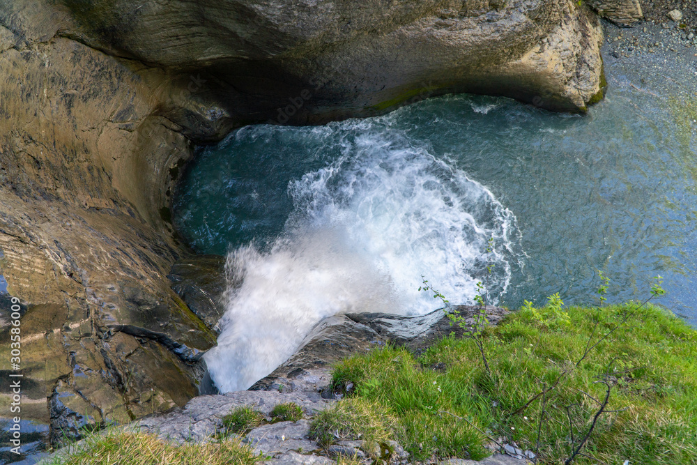 Long exposure of a hidden waterfall – waterfall in between massive rocks. Long exposure of a hidden waterfall – waterfall in between massive rocks.