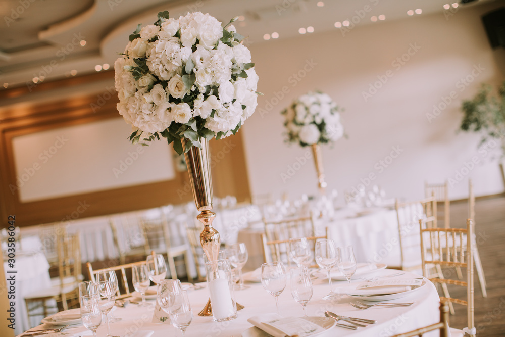 Wedding banquet tables with flowers decoration