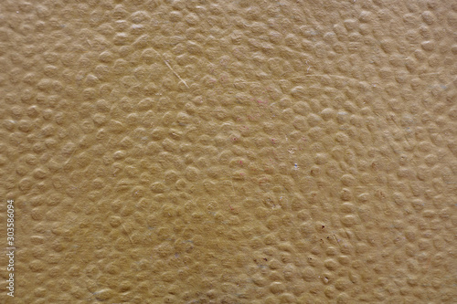 Abstract background. A close-up of faux leather brown. Brutal surface for the backdrop