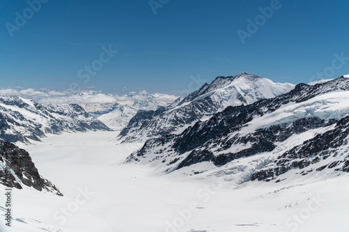 Panoramic view on winter snowy mountains at nice sunny evening. © Kristian