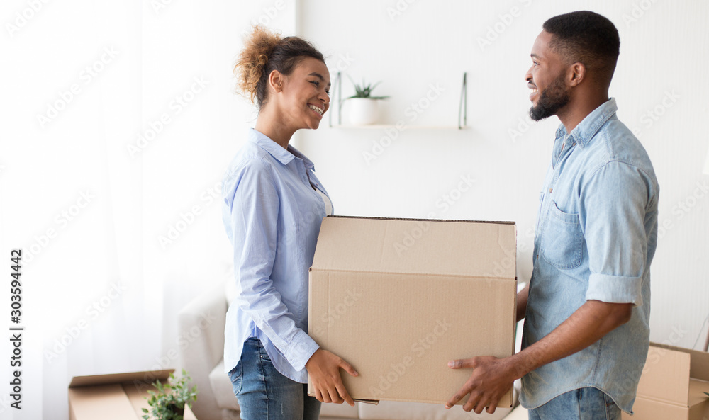 Black Spouses Carrying Moving Box Smiling Each Other Indoor Black Spouses Carrying Moving Box Smiling Each Other Indoor