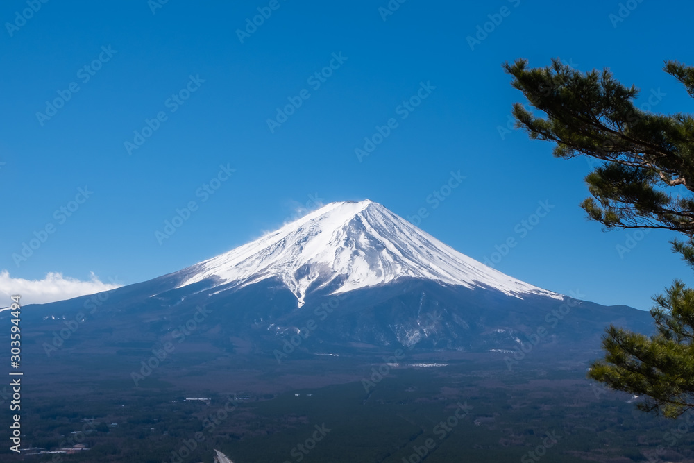 View of Mount Fuji, commonly called Fuji san in Japanese, Mount Fuji's exceptionally symmetrical cone, which is snow capped for about five months a year. It is a well known as the symbol of Japan.