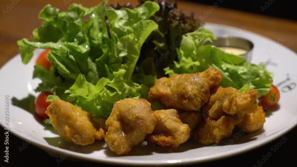 fried karake chicken with salad on plate fried karake chicken with salad on plate