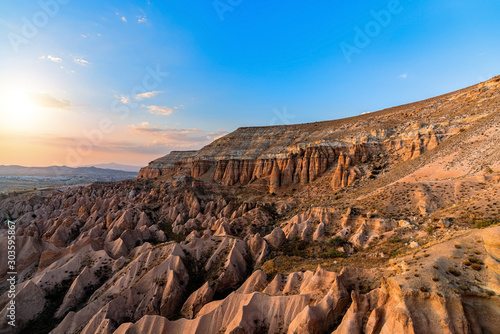 mountains and Red valley at sunset in Goreme, Cappadocia in Turkey.