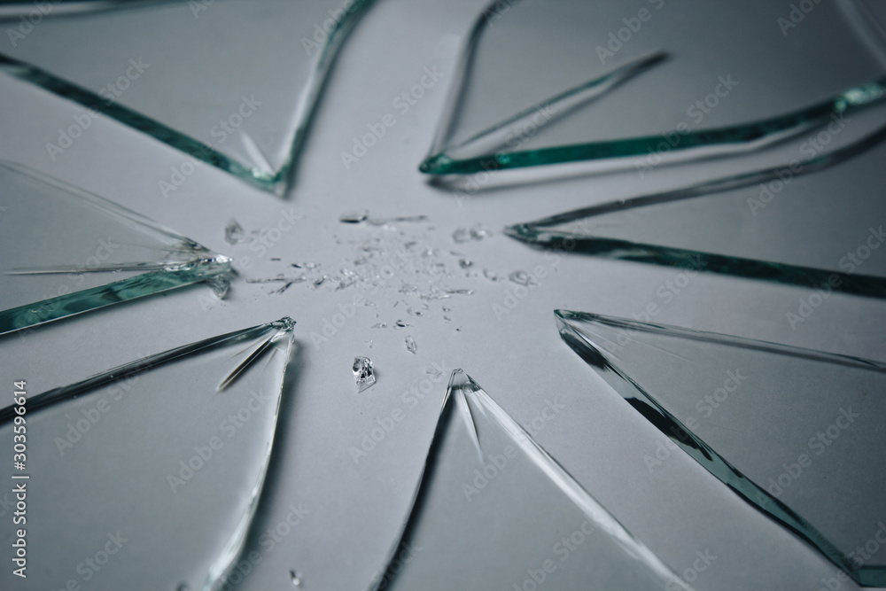 Broken glass pile pieces of texture and background isolated on white, cracked window effect. Emergency condition.